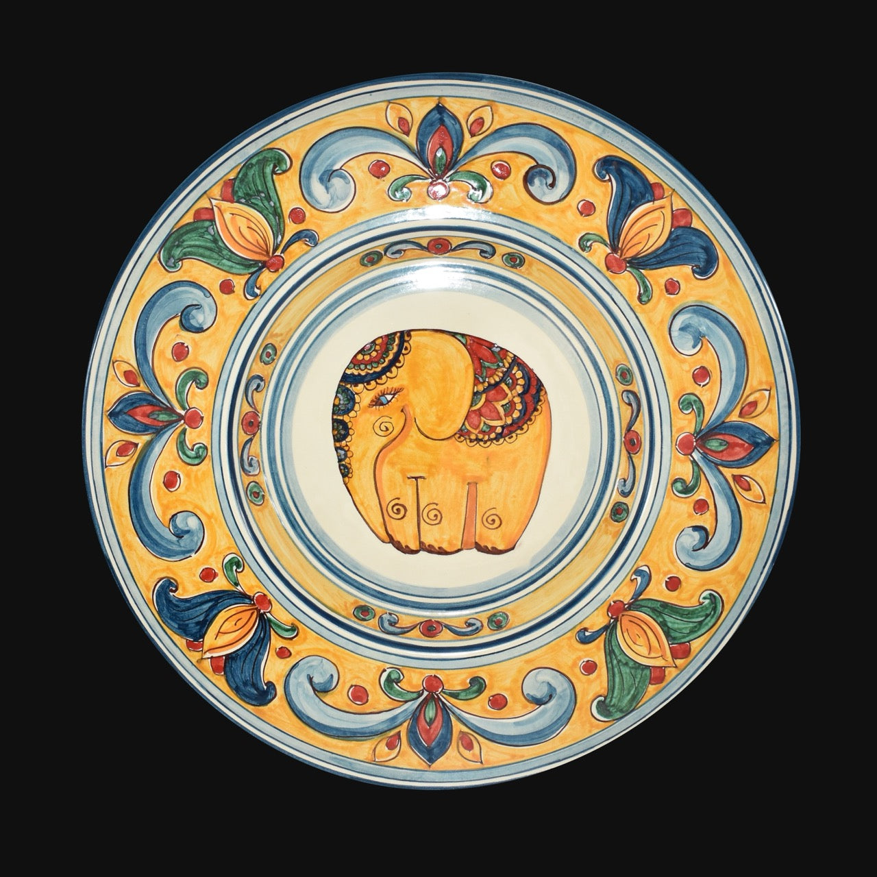 Caltagirone ceramic wall plate with elephant decoration and orange background